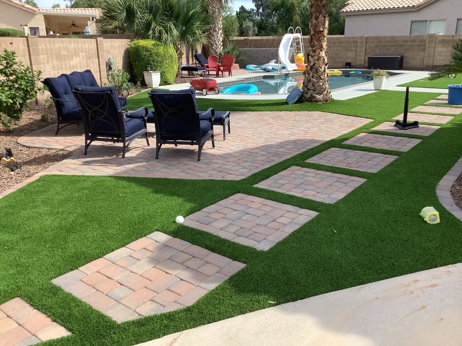 Backyard artificial turf, pavers, and patio cover installation in Mesa, Arizona by Green Forever Arizona