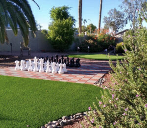 giant chess board on artificial turf and pavers