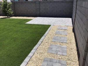 best low maintenance backyard tips - pavers and artificial grass